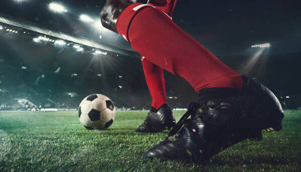 Close-Up of a Football Boot and Ball — Night Stadium Poster