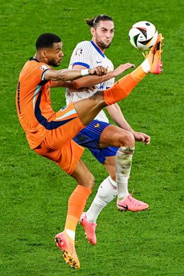 Cody Gakpo Netherlands controls the ball v Adrien Rabiot France Group D EURO 2024