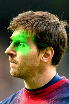 Lionel Messi of Barcelona illuminated