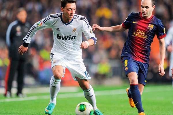 Mesut Ozil of Real v Andres Iniesta of Barcelona