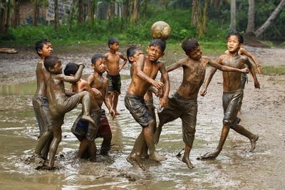 Kids Playing Football in the Mud — Poster