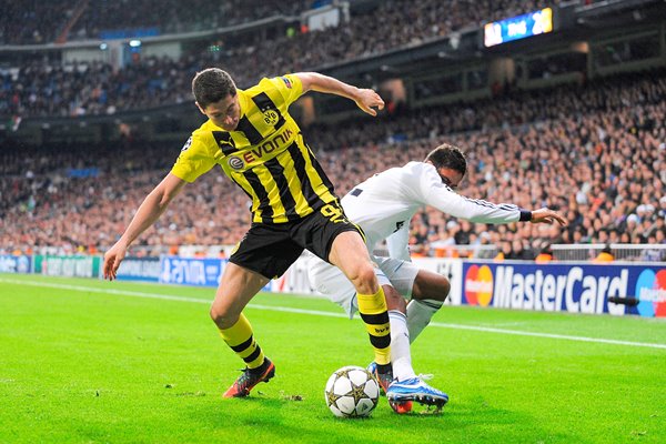 Robert Lewandowski of Borussia Dortmund battles the ball
