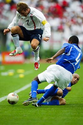 Roque Junior of Brazil and David Beckham
