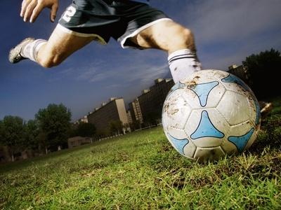 Soccer Player Kicking the Ball — Action Photo Poster